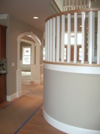 Custom Home Remodeling round staircase landing